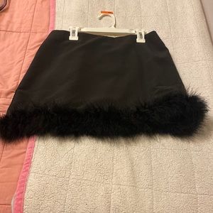 Two piece matching black faux fur skirt and jacket.